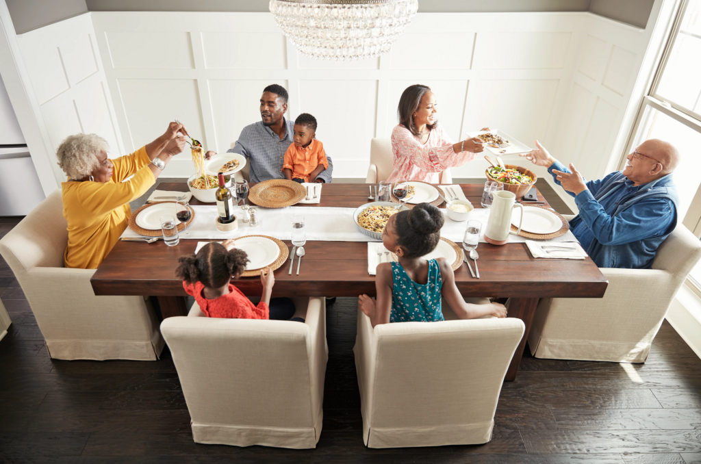 Family having breakfast at the dining table | Corvin's Furniture & Flooring