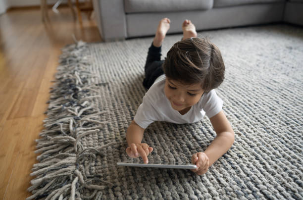 Girl laying on rug | Corvin's Furniture & Flooring